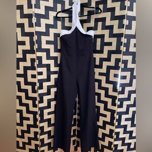Black jumpsuit with white halter trim straps, size Medium
